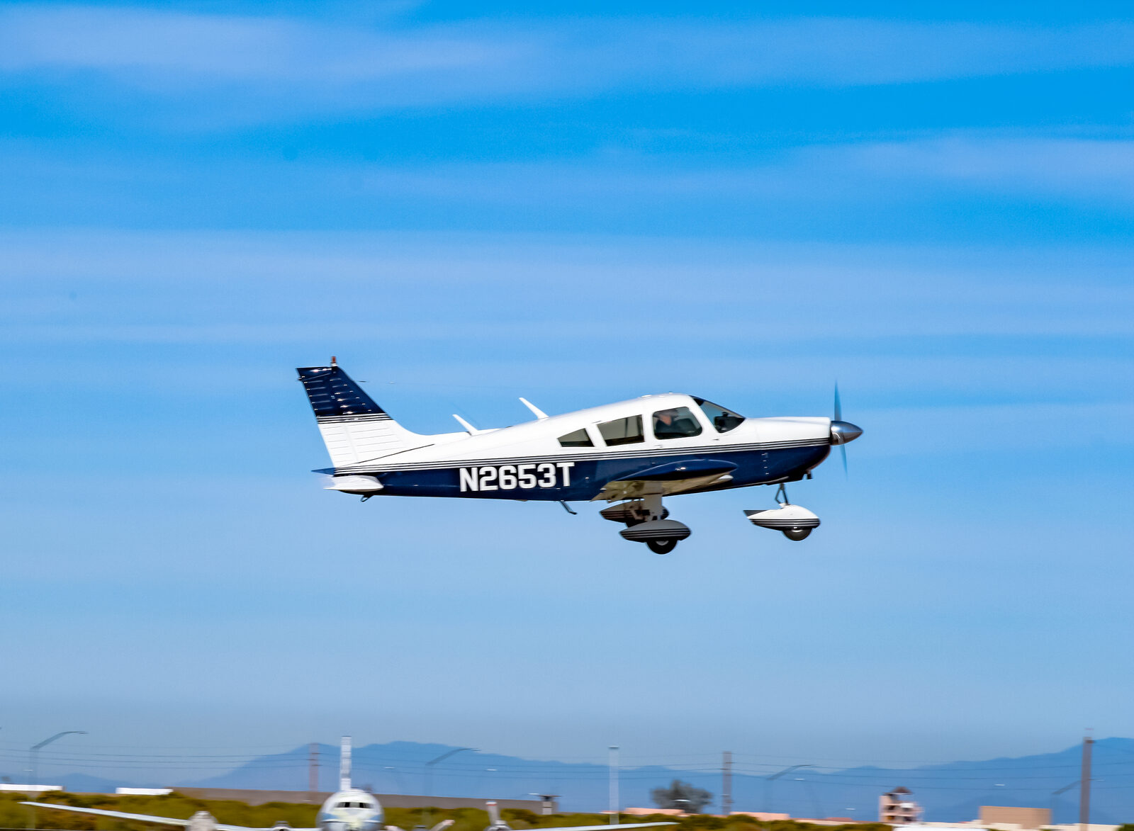 The club's Piper Cherokee 235F, N2653T, departing Falcon Field